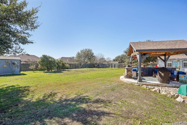 view of yard with a jacuzzi and a patio