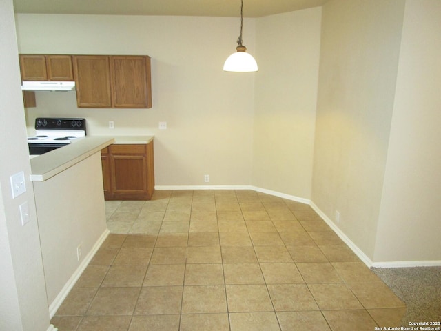 kitchen with electric stove, hanging light fixtures, and light tile patterned flooring