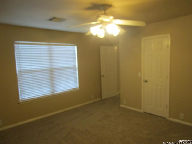 interior space with plenty of natural light and ceiling fan