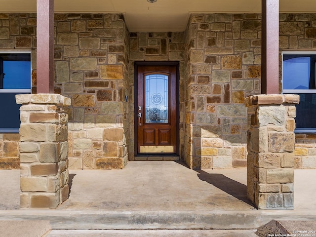 view of exterior entry with stone siding