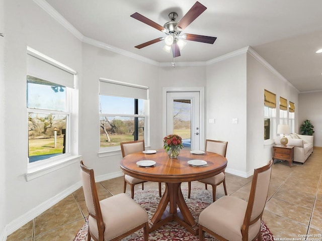 dining space with crown molding, ceiling fan, and light tile patterned flooring