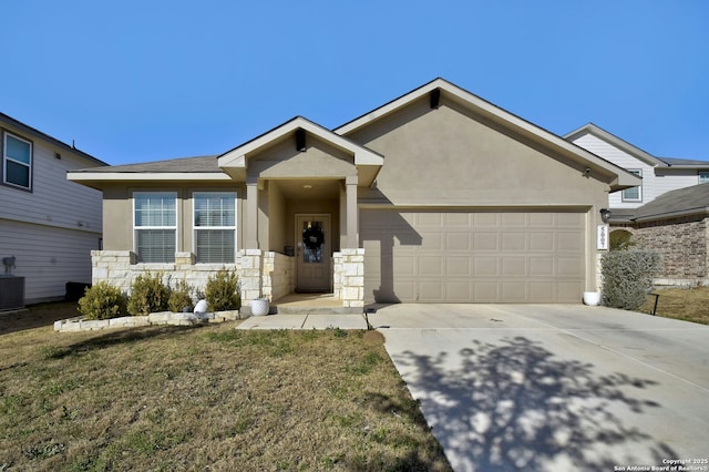 view of front of home with a garage and a front lawn