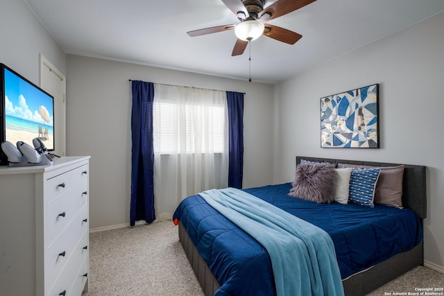 bedroom featuring light carpet and ceiling fan