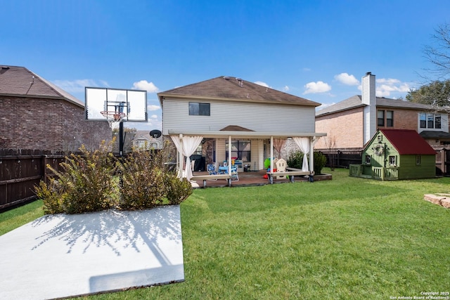 rear view of house with a patio and a yard