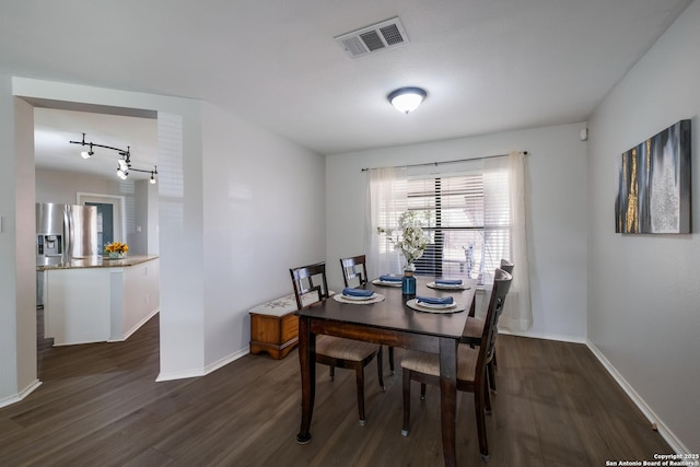 dining area featuring dark hardwood / wood-style floors