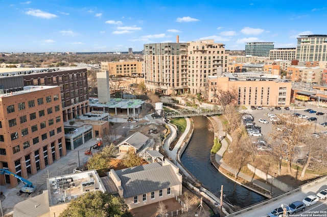 birds eye view of property featuring a water view and a view of city