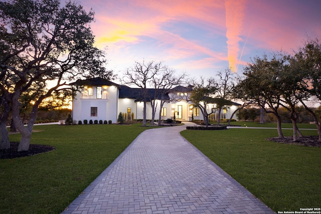 view of front of home with a lawn