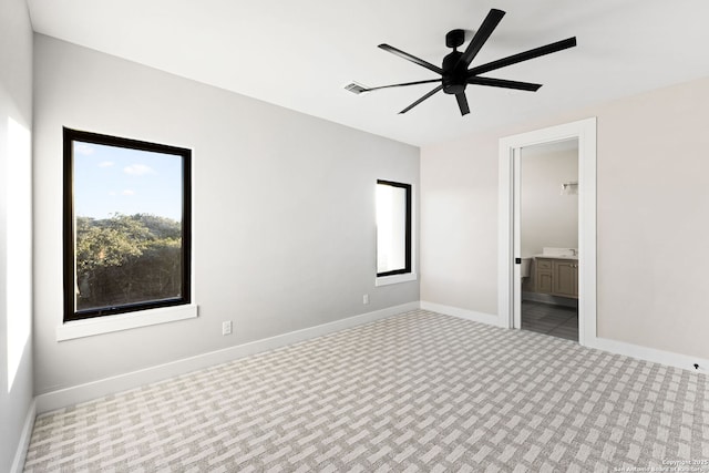 empty room with light colored carpet and ceiling fan