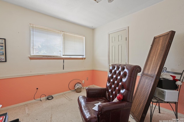 sitting room with plenty of natural light and carpet