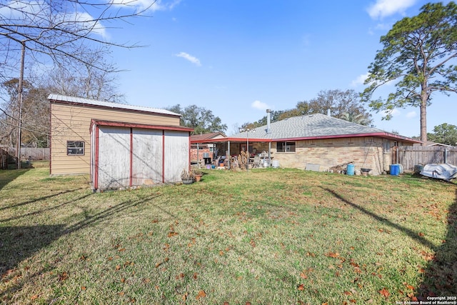 view of yard with a garage and an outdoor structure