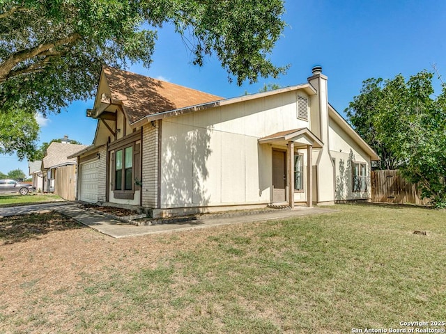 view of front of home featuring a garage and a front yard