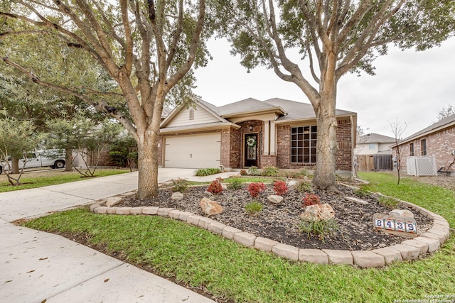 view of front facade with a garage and a front yard