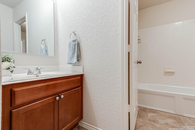 bathroom featuring shower / bathtub combination and vanity