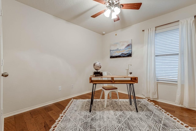 office with ceiling fan and light wood-type flooring