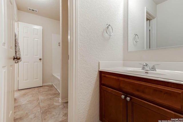 bathroom featuring vanity and tile patterned flooring