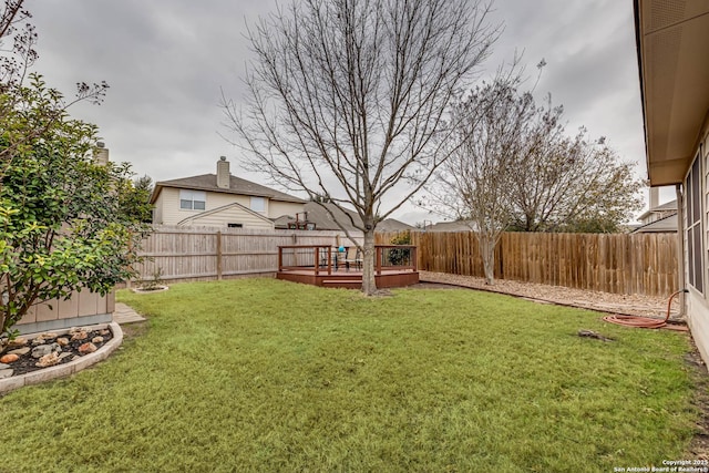 view of yard with a wooden deck