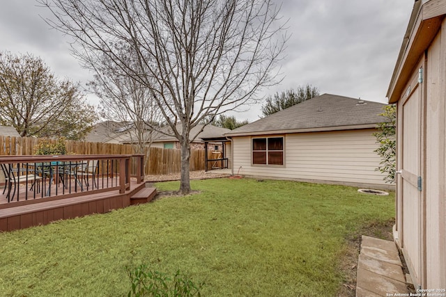 view of yard with a wooden deck