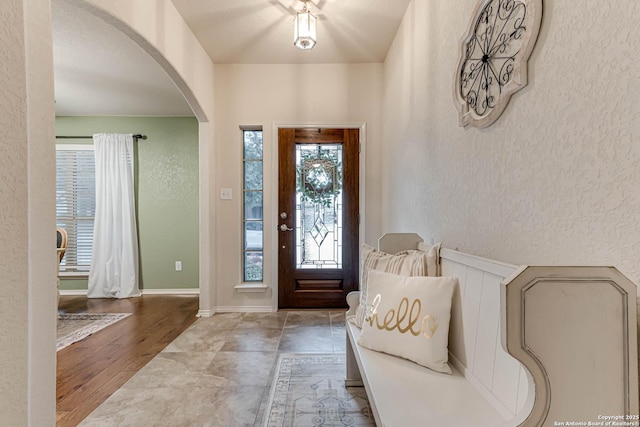 foyer entrance with light hardwood / wood-style floors