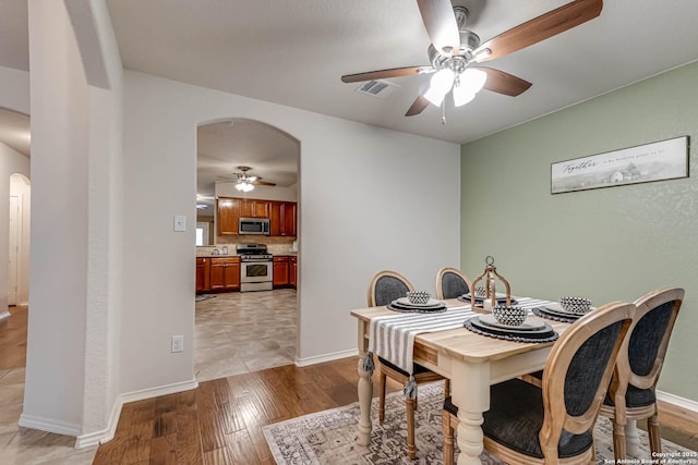 dining area featuring ceiling fan and light hardwood / wood-style floors