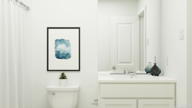 bathroom featuring vanity and toilet