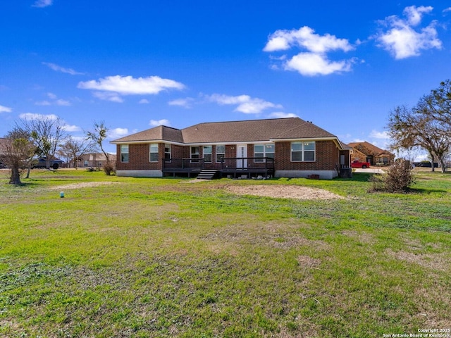 back of house with a wooden deck and a yard