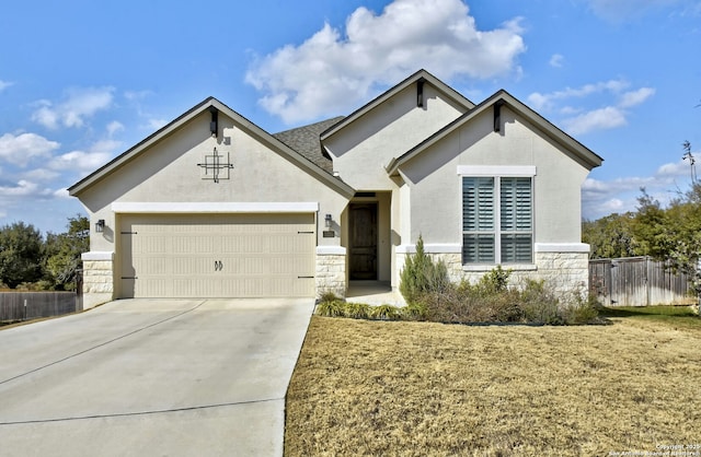 view of front of property with a garage and a front yard