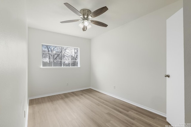 empty room featuring ceiling fan and light hardwood / wood-style flooring