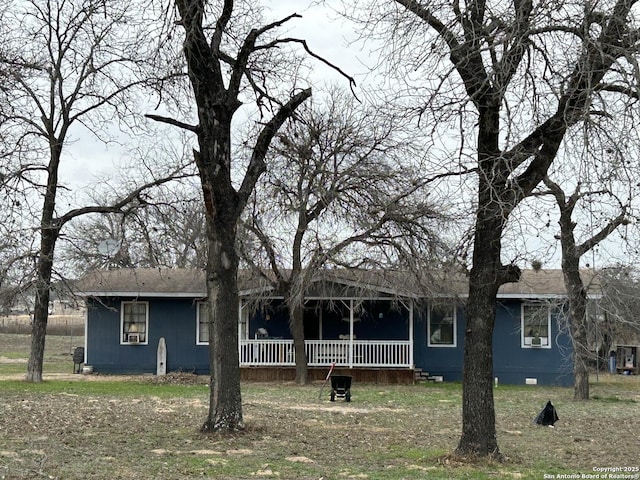 back of property with covered porch