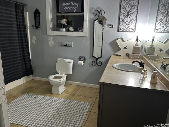 bathroom with a shower with curtain, tile patterned floors, toilet, and vanity