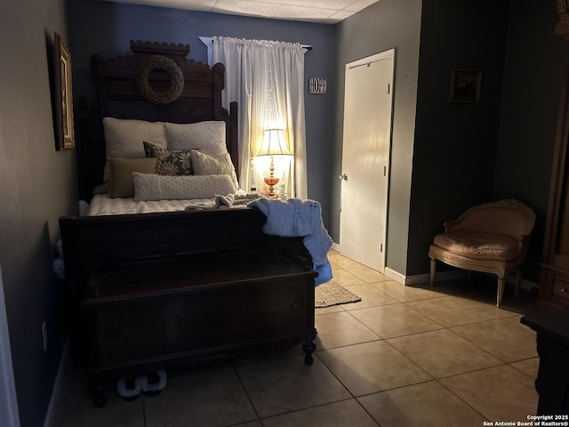 bedroom with light tile patterned floors