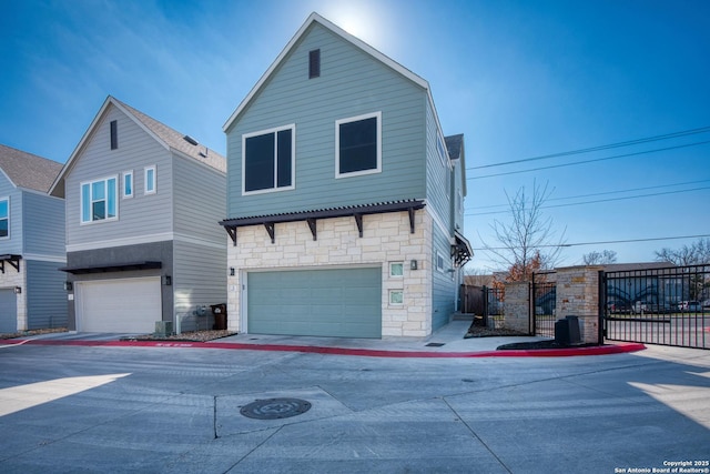 view of property with a garage and cooling unit