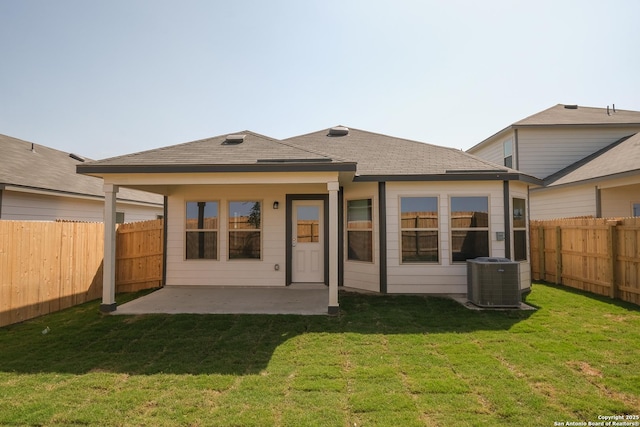 4237 Carlotta Dr, New Braunfels, TX 78130 - back of property with a patio, a fenced backyard, central AC unit, and a lawn