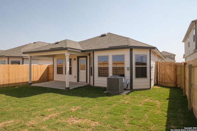 4237 Carlotta Dr, New Braunfels, TX 78130 - back of house with a lawn, central air condition unit, a fenced backyard, and a patio area