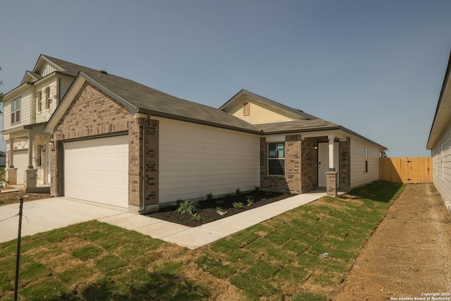 4237 Carlotta Dr, New Braunfels, TX 78130 - view of front of house with brick siding, fence, a garage, a front yard, and concrete driveway