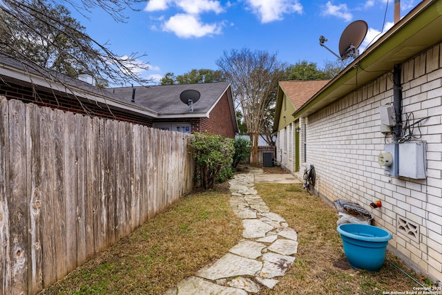 view of yard featuring central AC unit