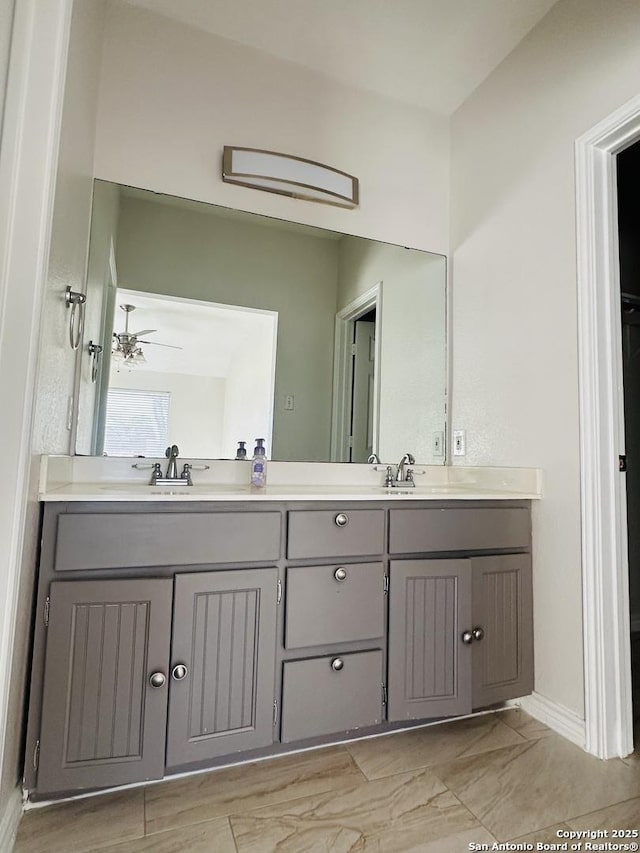 bathroom featuring vanity and ceiling fan