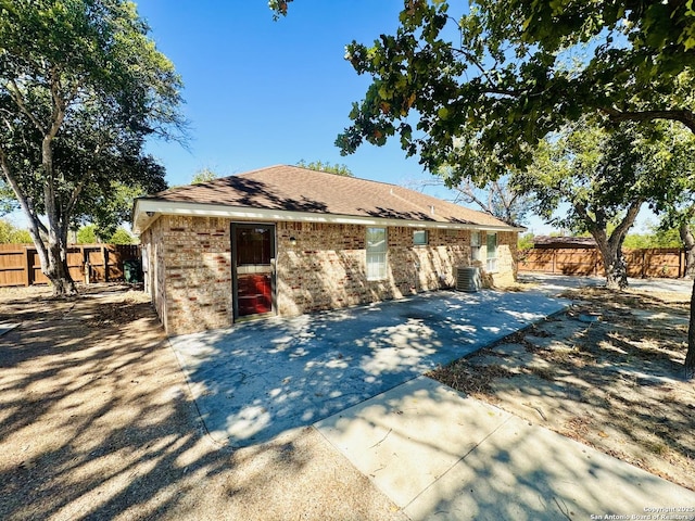 view of front of house featuring a patio and central air condition unit