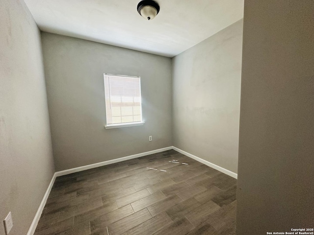 empty room featuring dark hardwood / wood-style floors