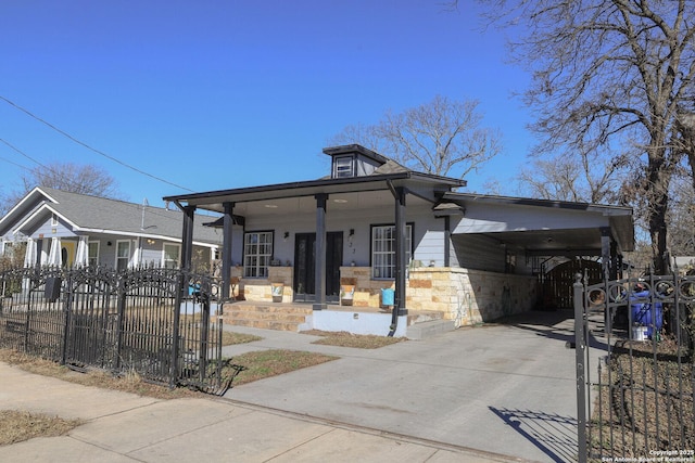 view of front of home featuring a carport and a porch