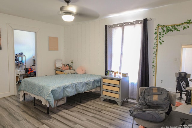 bedroom with hardwood / wood-style flooring