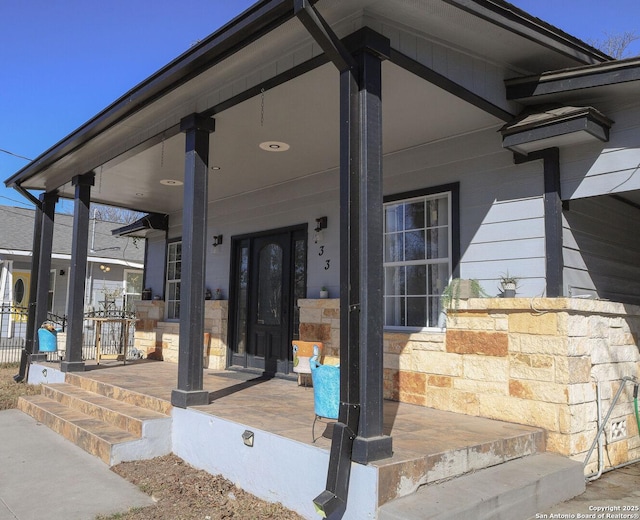 doorway to property with a porch