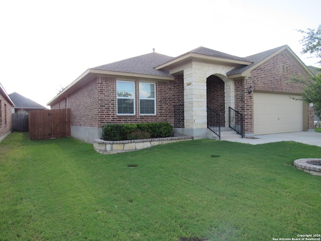 single story home featuring a garage and a front yard