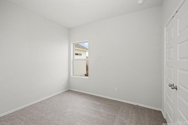 empty room featuring carpet flooring