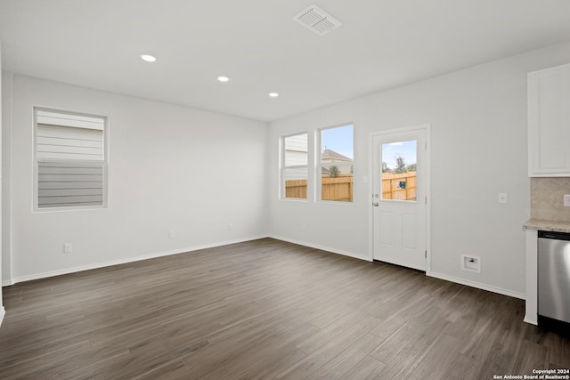 unfurnished living room with dark hardwood / wood-style floors