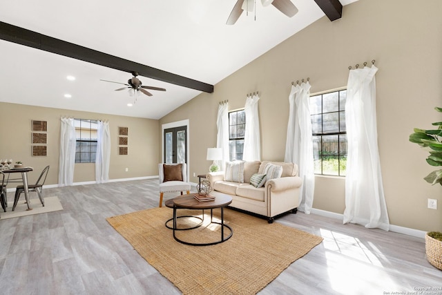 living room featuring ceiling fan, vaulted ceiling with beams, and light wood-type flooring