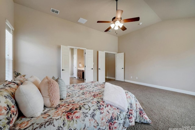 carpeted bedroom with ceiling fan, connected bathroom, and high vaulted ceiling