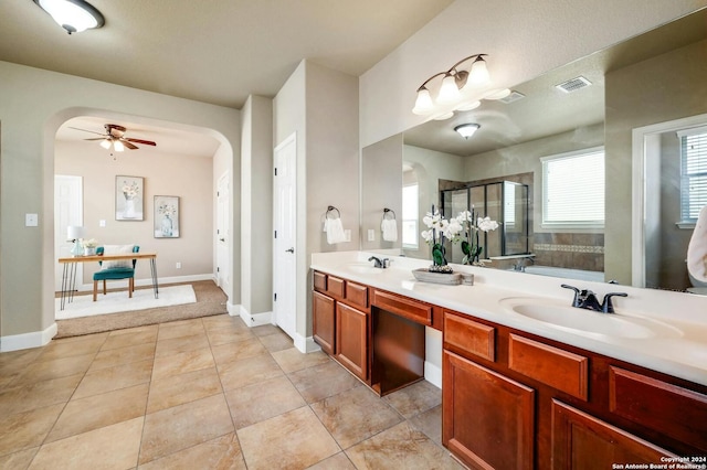 bathroom featuring plus walk in shower, tile patterned floors, ceiling fan, and vanity