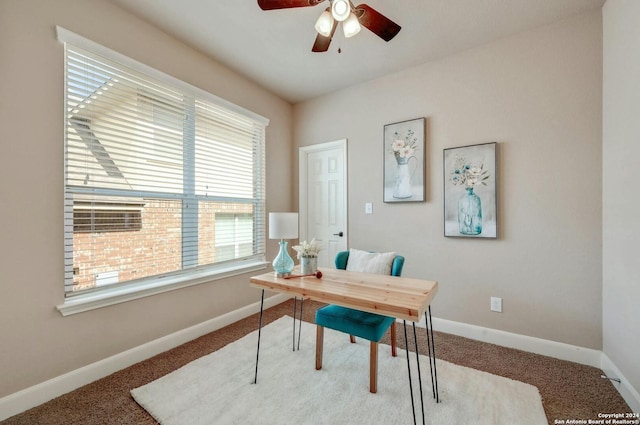 office space with carpet floors and ceiling fan