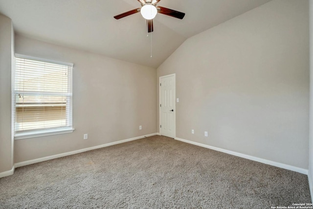 unfurnished room with ceiling fan, vaulted ceiling, and carpet