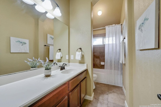 full bathroom featuring tile patterned floors, vanity, toilet, and shower / tub combo